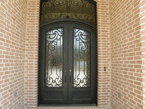 Custom Extra Large Iron Doors with Transom on French Country Exterior 